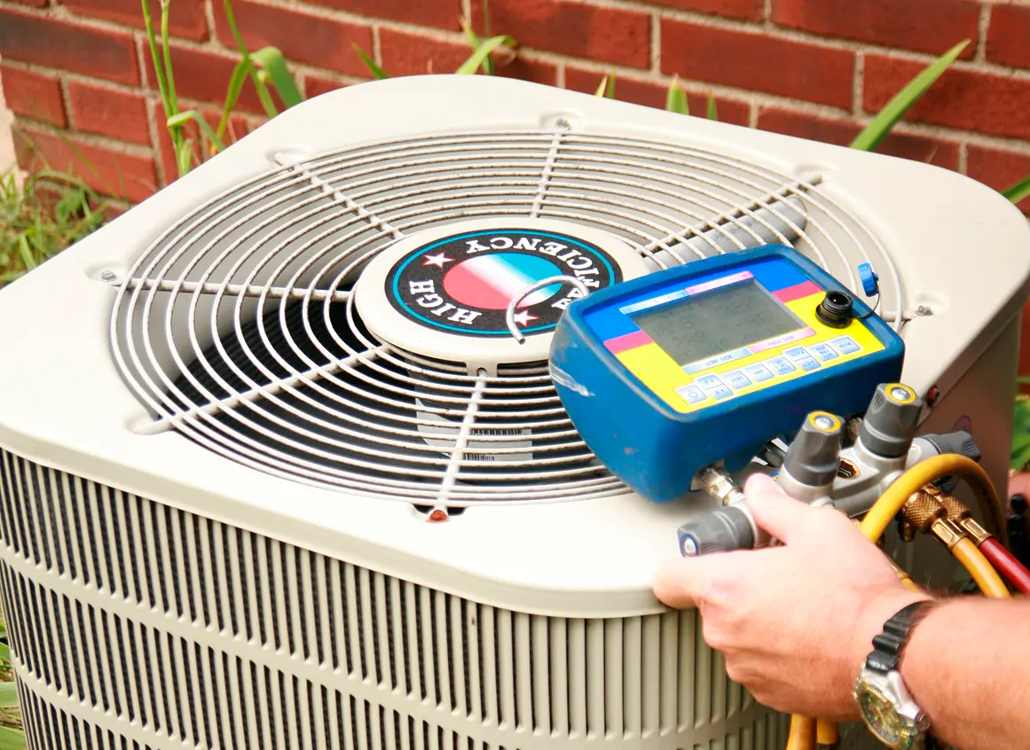 Air conditioning unit being serviced